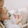 Lifestyle_Pacidose_with_toddler_stage2_green_with_white_medicine Bliss & Bless-Dr. Brown's Pacidose 奶咀形餵藥器